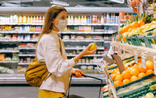 A woman in a grocery store looking for natural herpes treatment