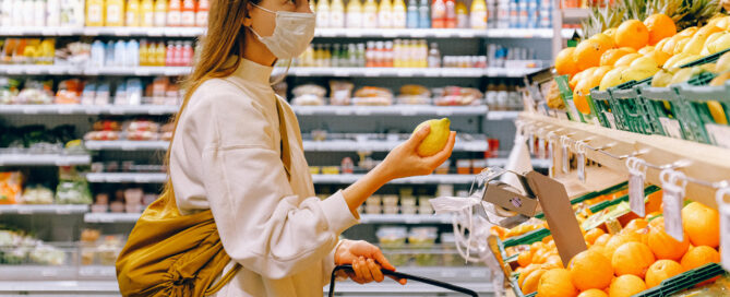 A woman in a grocery store looking for natural herpes treatment