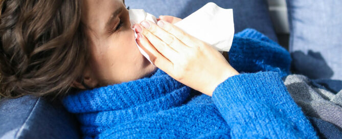 A sick woman needing to treat her virus with holistic naturopathy