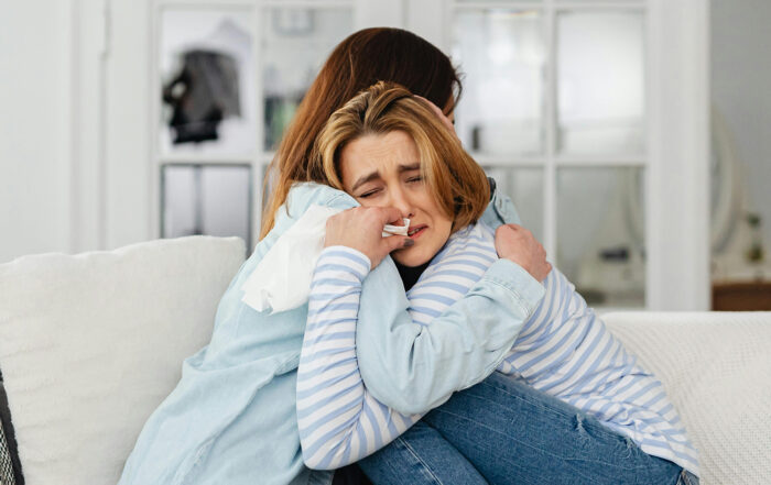 A woman with grief needing naturopathic support